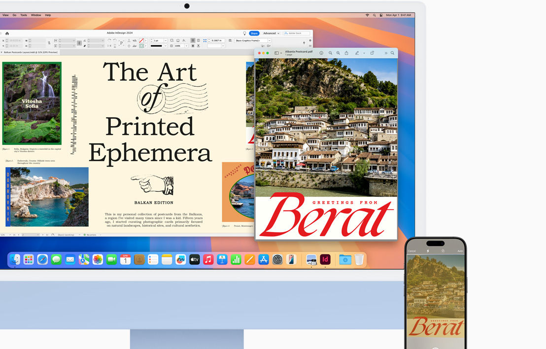 Sebuah iMac biru dengan iPhone di sampingnya, menunjukkan dokumen dengan ilustrasi pada kedua perangkat melalui fitur Handoff.