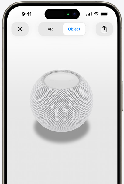 White HomePod on the screen of an iPhone in AR view.