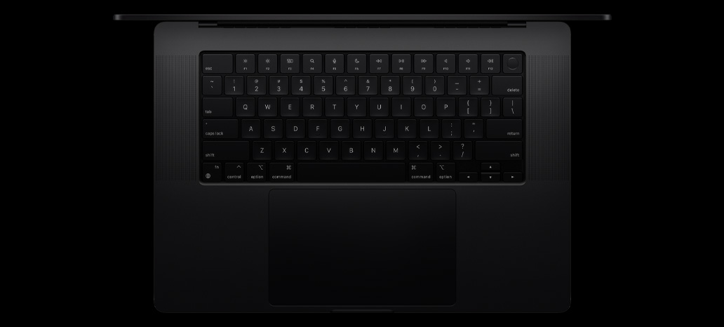 Изглед отгоре на MacBook Pro с вградената Magic Keyboard с Touch ID и тракпад